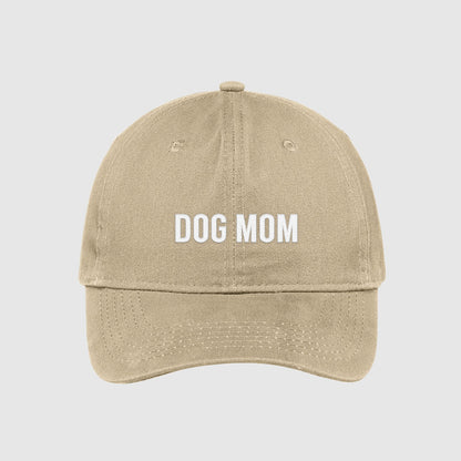 Tan Dog Mom Hat embroidered with white text.