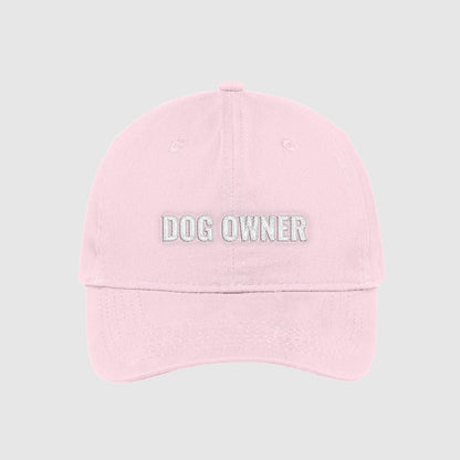 Blush light pink dad hat with Dog Owner embroidered on the front with white thread.